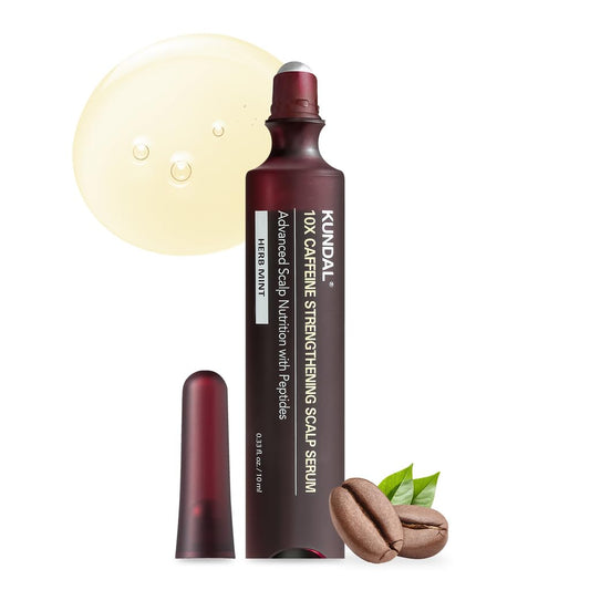Kundal scalp serum with coffee bean and green leaf on a white background