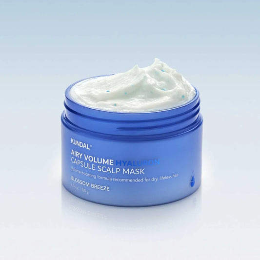 Blue jar of Kundal Airy Volume Hyaluron Capsule Scalp Mask on a light gray background