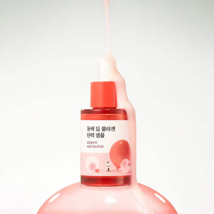 Pink bottle with red cap on a white background