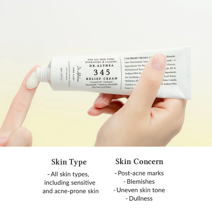 Hand holding a tube of Dr. Althea relief cream with product details on a light background