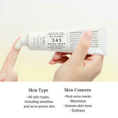 Hand holding a tube of Dr. Althea relief cream with product details on a light background