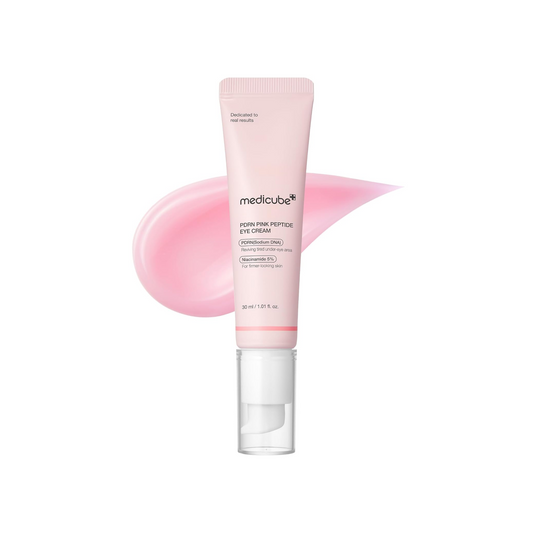 Pink eye cream tube with pink smear on a white background