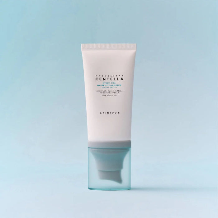 Skincare tube with 'SKIN1004' branding on a light blue background