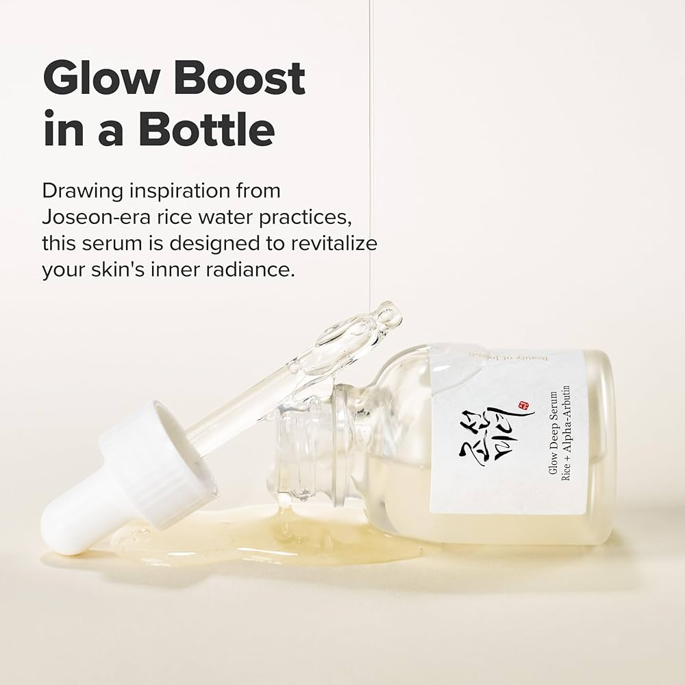 Serum bottle with a label on a light background, text about glow boost and Joseon-era rice water practices.