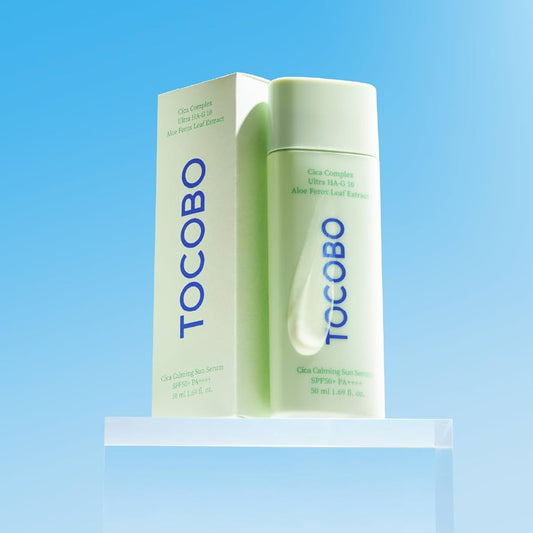 Tocobo skincare product on a clear stand with a blue gradient background