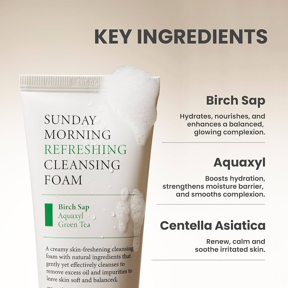 Cleansing foam tube with key ingredients listed on a beige background