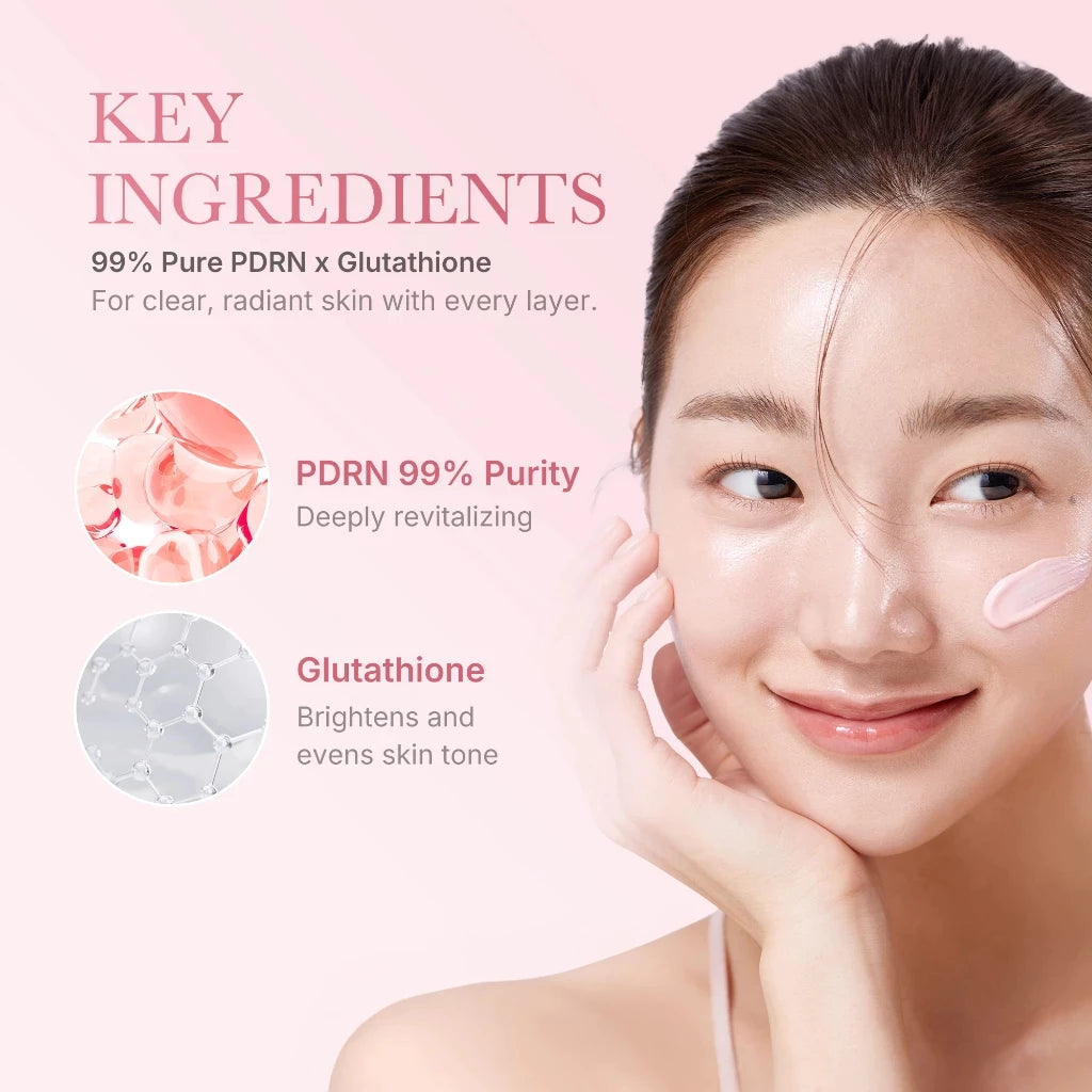 Woman with clear skin showing key ingredients of skincare product on a pink background